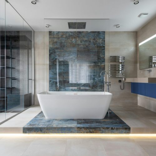 Elegant bathroom featuring a ceramic freestanding tub and contemporary design elements.